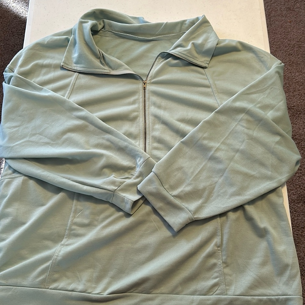 SHEIN lightweight quarter zip jacket with hoodie pocket.